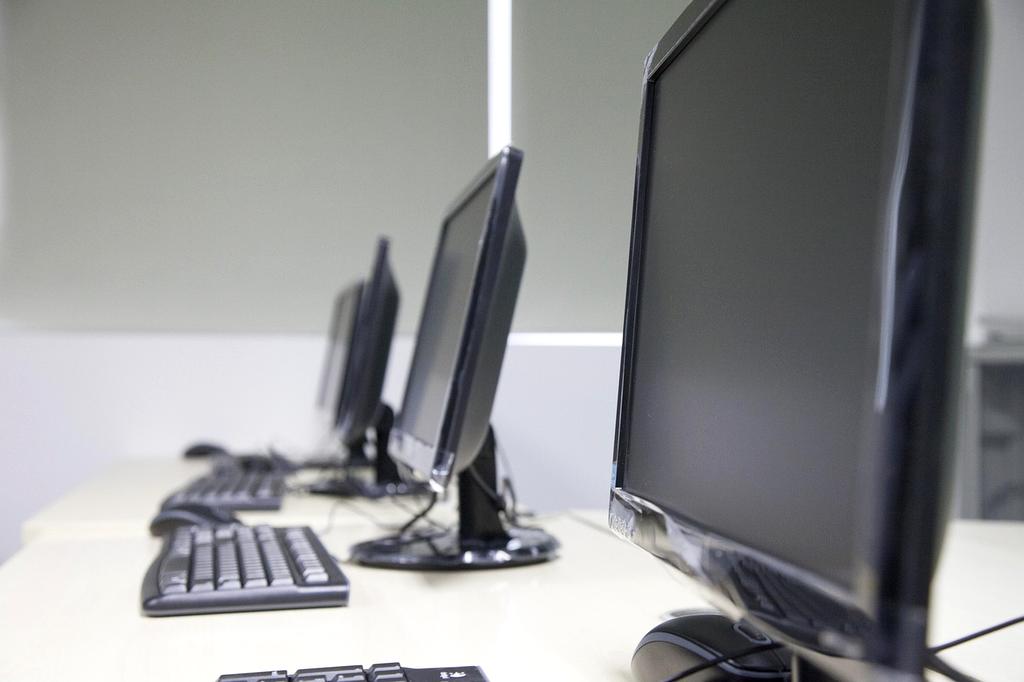 Diverse group of people learning computer skills