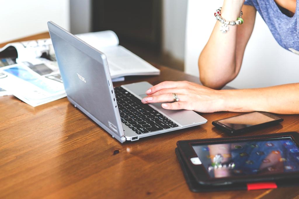Person typing on laptop ready to start